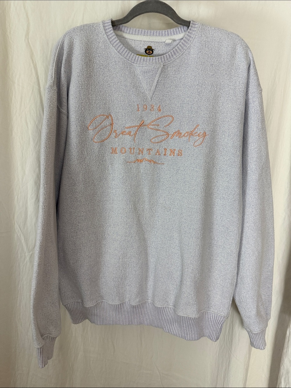 Light colored Crewneck Sweater with Peach Script Logo great Smoky Mountains